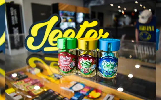 A dispensary counter display lit in warm neon